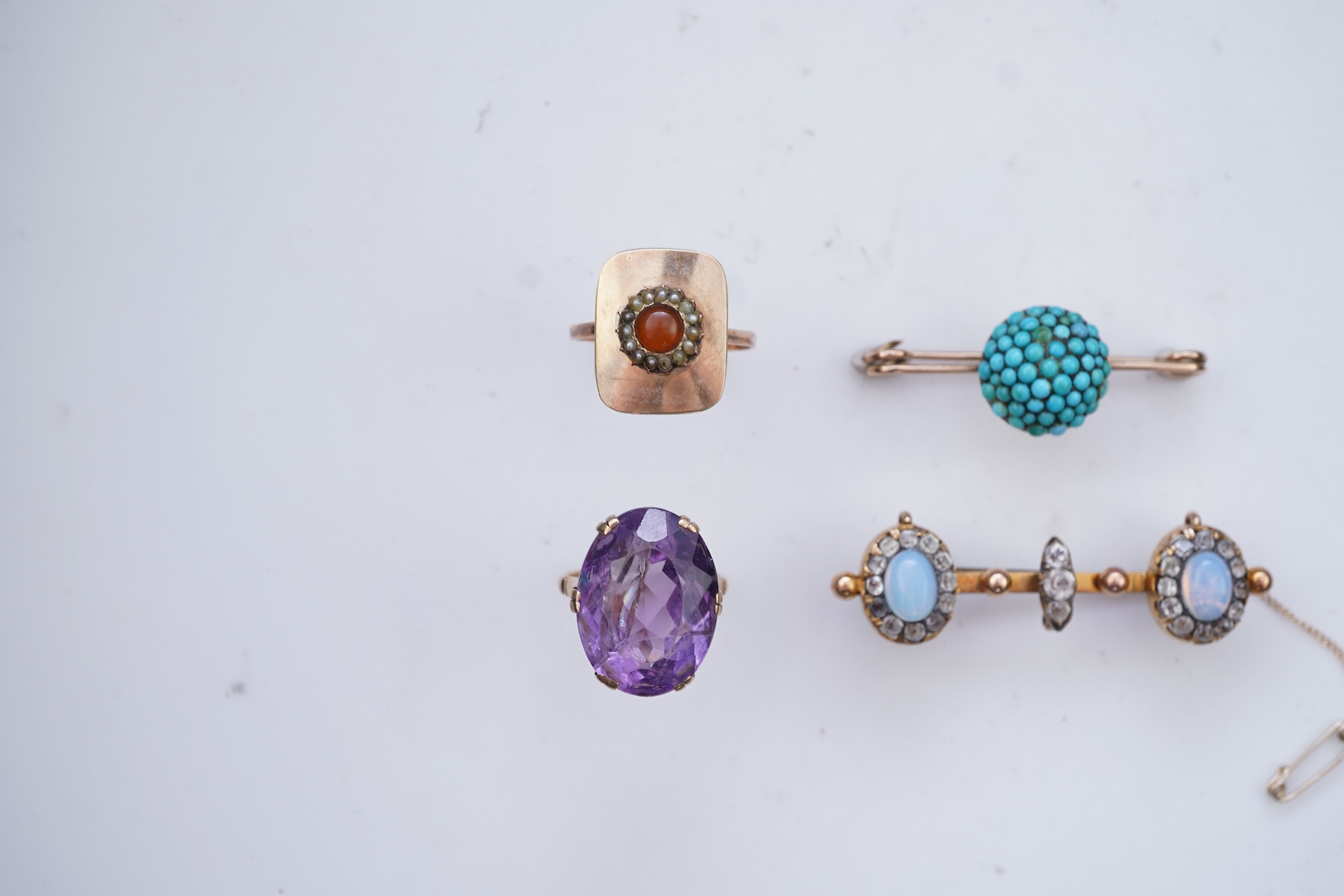 Three rings and a brooch